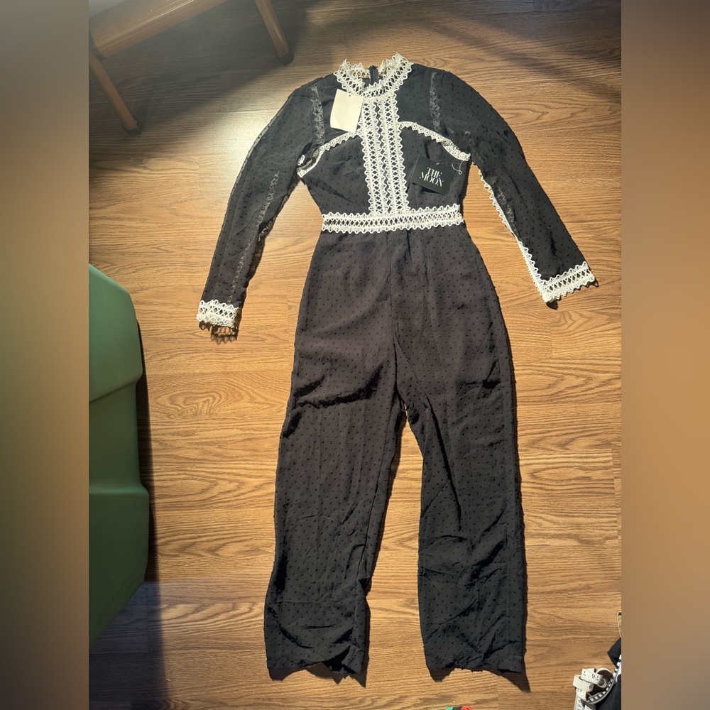NWOT Chic Black Lace-Trimmed Jumpsuit